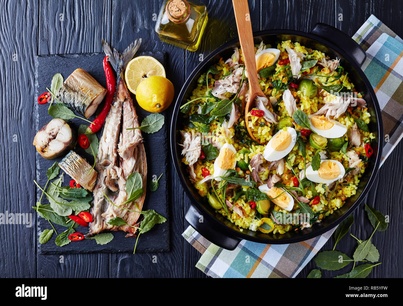 delicious Kedgeree with flaked smoked fish, hard boiled eggs, rice, kale, brussel sprouts