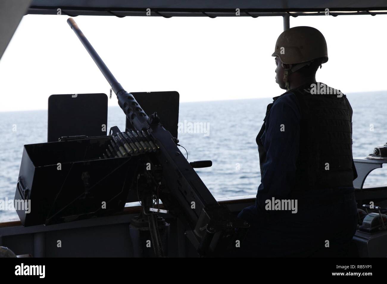 GULF OF OMAN (Dec. 17, 2018) Quartermaster 3rd Class Tresean Phillips stands watch aboard Cyclone-class coastal patrol ship USS Thunderbolt (PC 12) during a maritime patrol in the Gulf of Oman. Thunderbolt is deployed to the U.S. 5th Fleet area of operations in support of naval operations to ensure maritime stability and security in the Central Region, connecting the Mediterranean and the Pacific through the western Indian ocean and the three strategic choke points. Stock Photo