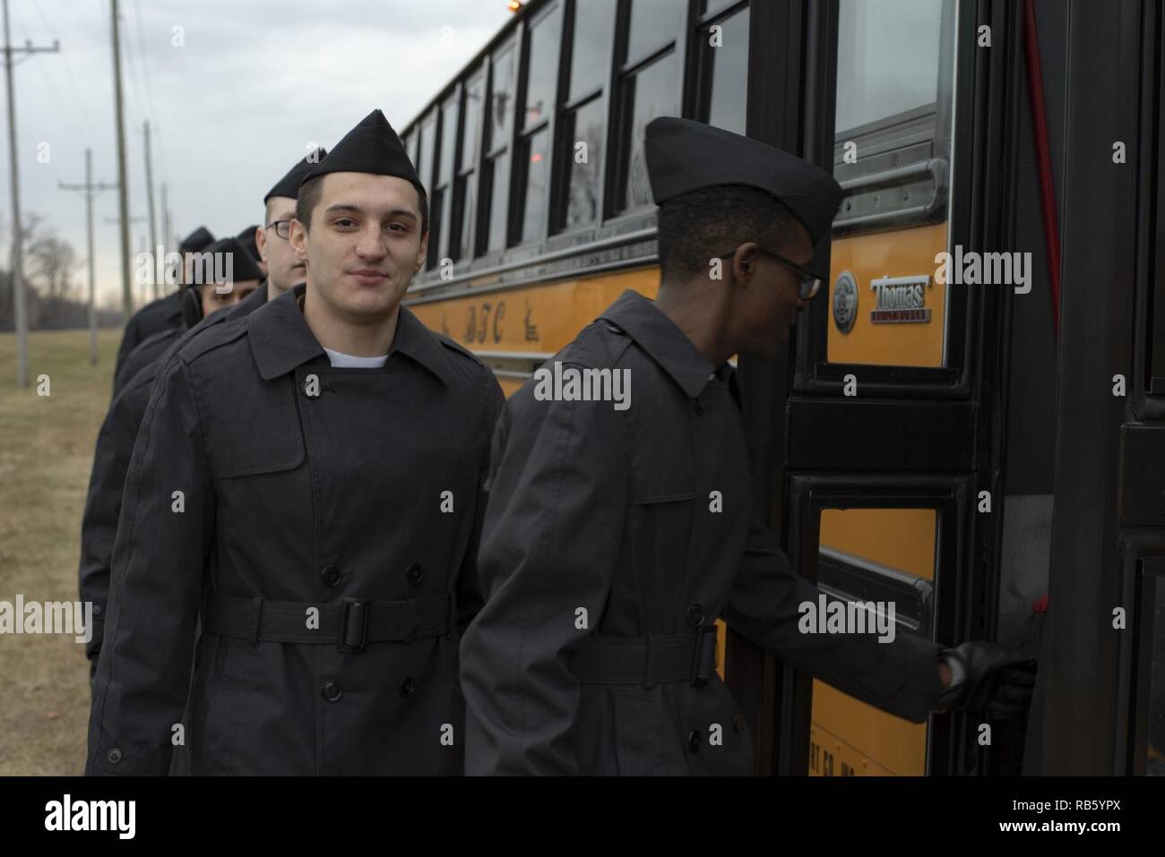GREAT LAKES, Ill. (Dec. 25, 2018) Recruits board a bus to leave Recruit