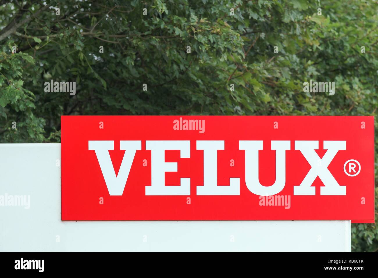 Ostbirk, Denmark - September 5, 2015: Velux logo at the entrance of the factory. Velux is a danish company that specializes in windows and skylights Stock Photo