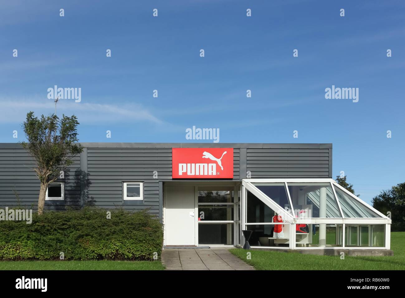 Skanderborg, Denmark - September 6, 2015: Puma logo on a wall. Puma is a major german multinational company that produces athletic and casual footwear Stock Photo