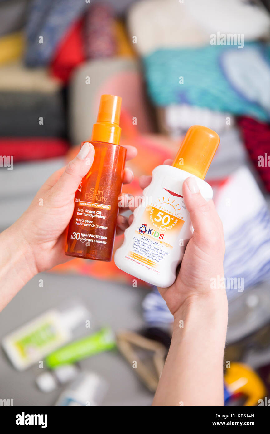 Tanning oil and sun block Stock Photo Alamy