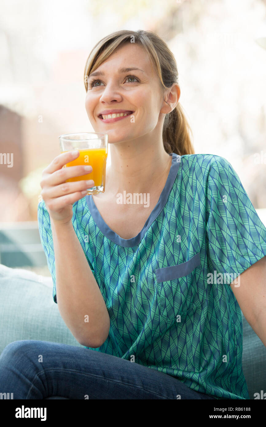 Woman drinking fresh fruit juice Stock Photo Alamy