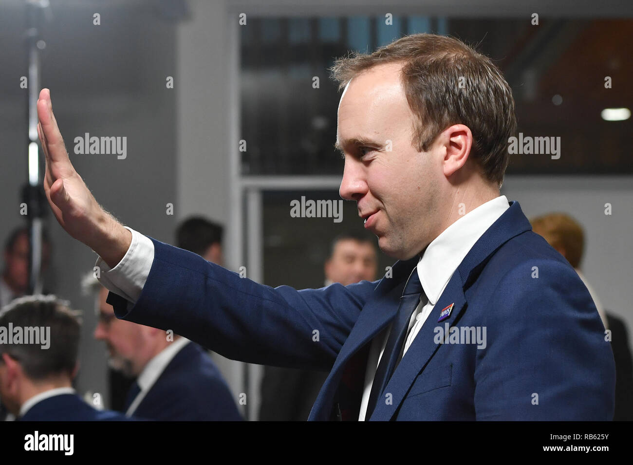 Health Secretary Matt Hancock gestures after Prime Minister Theresa May speaking at Alder Hey Children's Hospital, Liverpool during her visit where she launched the NHS Long Term Plan alongside NHS England Chief Executive Simon Stevens. Stock Photo