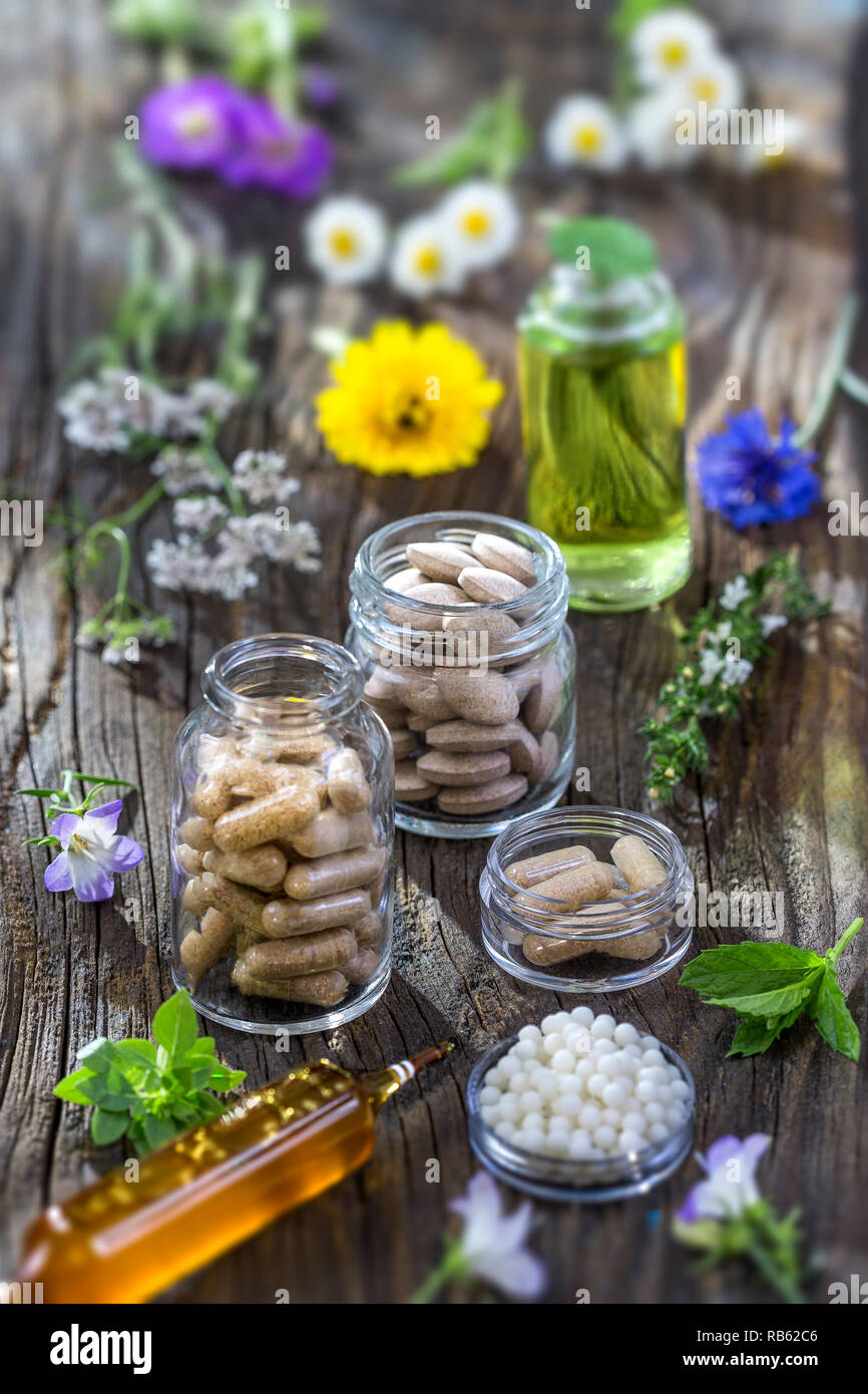Alternative herb medicine. herbal vitamin on wooden board Stock Photo