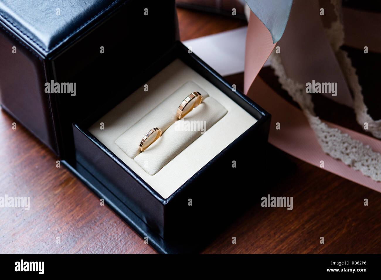 Wedding rings in a black and white jewelry box Stock Photo Alamy