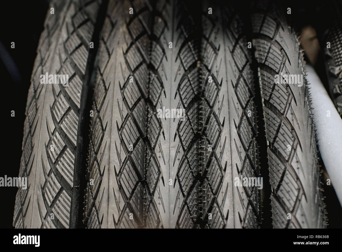 New bicycle tires hanging in a rack of a bicycle Stock Photo