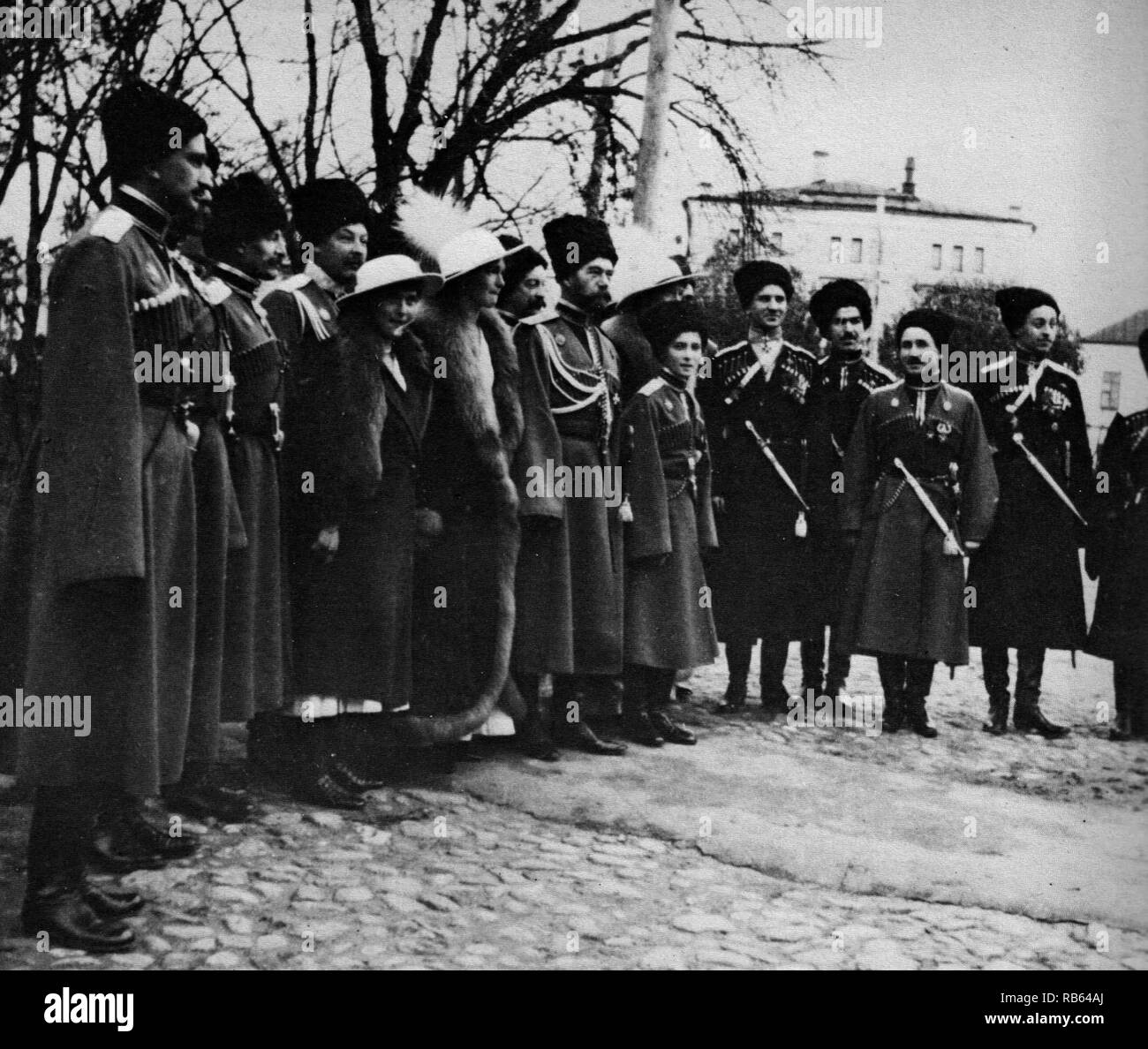 The Romanovs visiting a regiment during World War I. From left to right, Grand Duchess Anastasia, Grand Duchess Olga, Tsar Nicholas II, Tsarevich Alexei, Grand Duchess Tatiana, and Grand Duchess Maria, and Kuban Cossacks Stock Photo