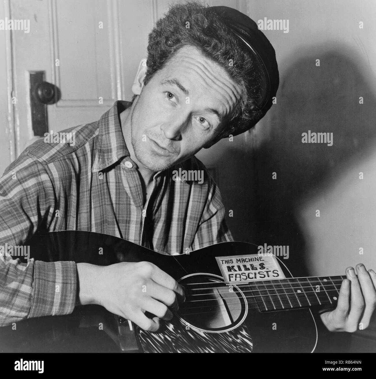 Portrait photograph of Woody Guthrie (Woodrow Wilson Guthrie) (1912-1967) American singer-songwriter. Dated 1943 Stock Photo