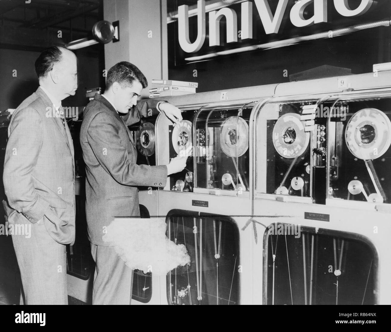Photograph of a Univac computer being prepared to predict the winning horses. Dated 1959 Stock Photo