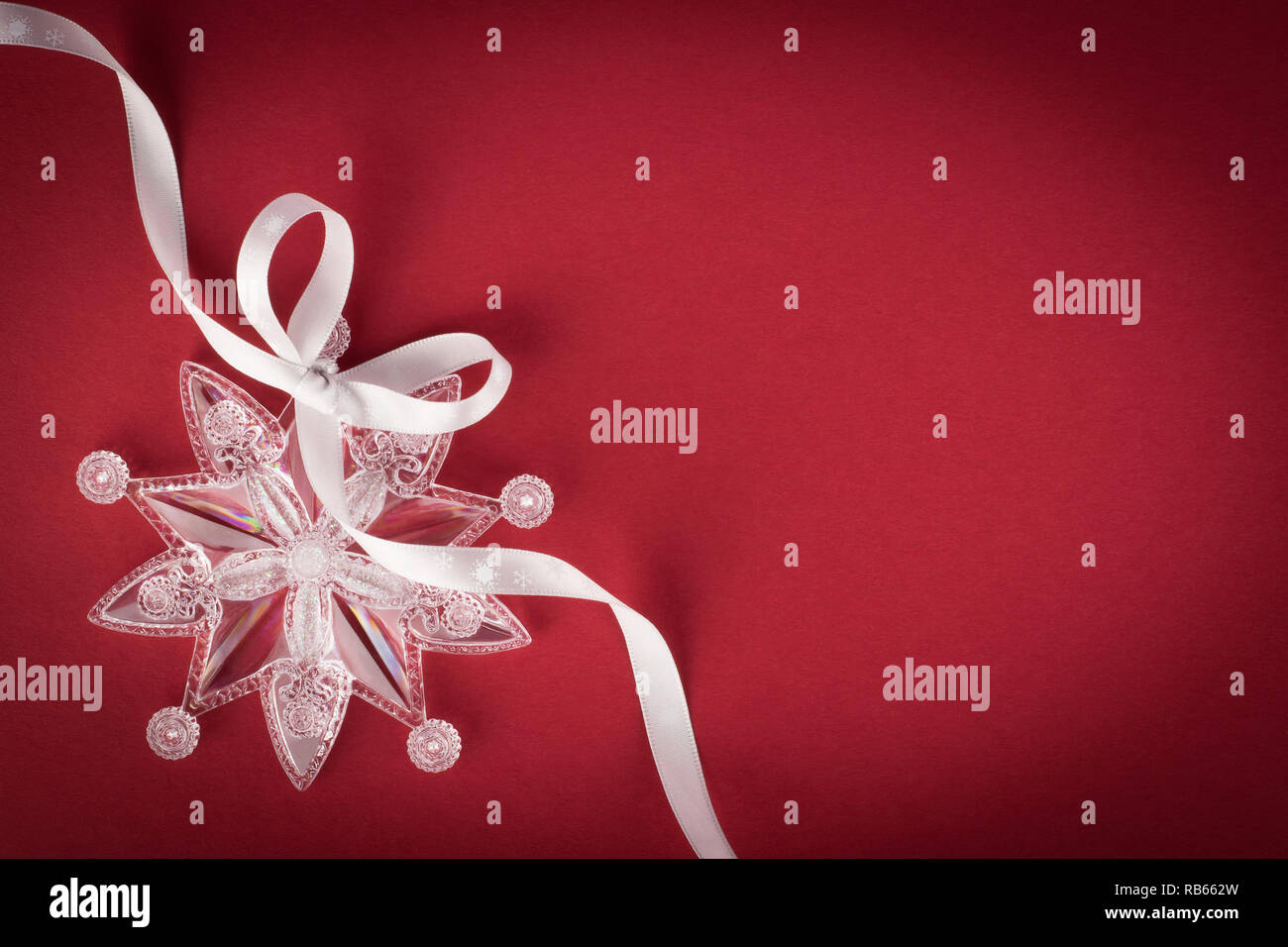Decorative snowflake with white spiral ribbon Stock Photo