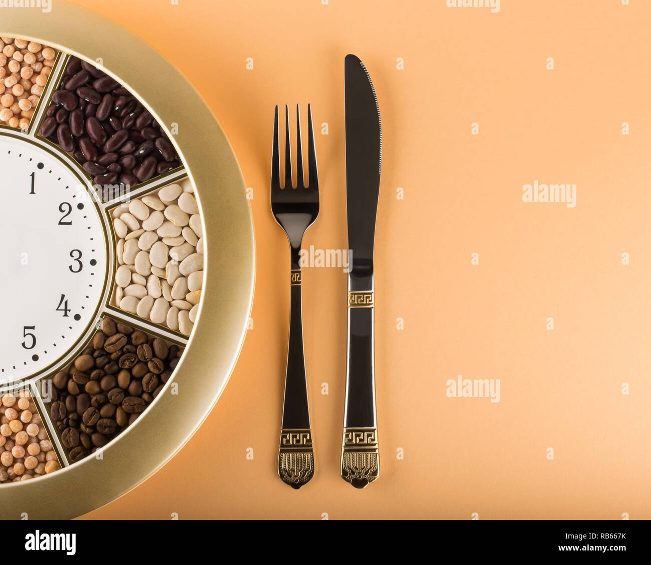 Wall Clock, Fork and Knife. Time for dinner! Stock Photo
