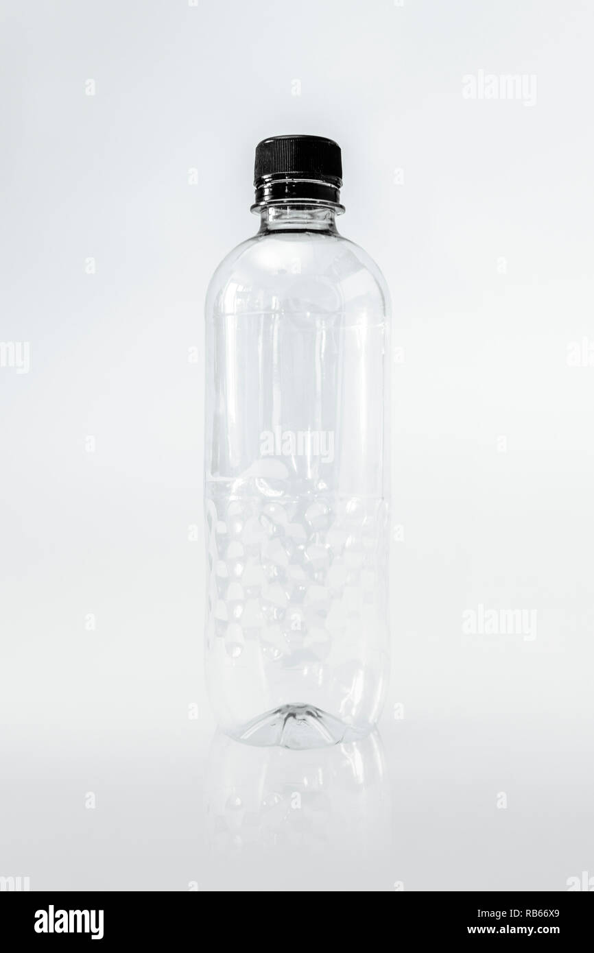 An empty generic single use plastic water bottle on a white background, no label Stock Photo
