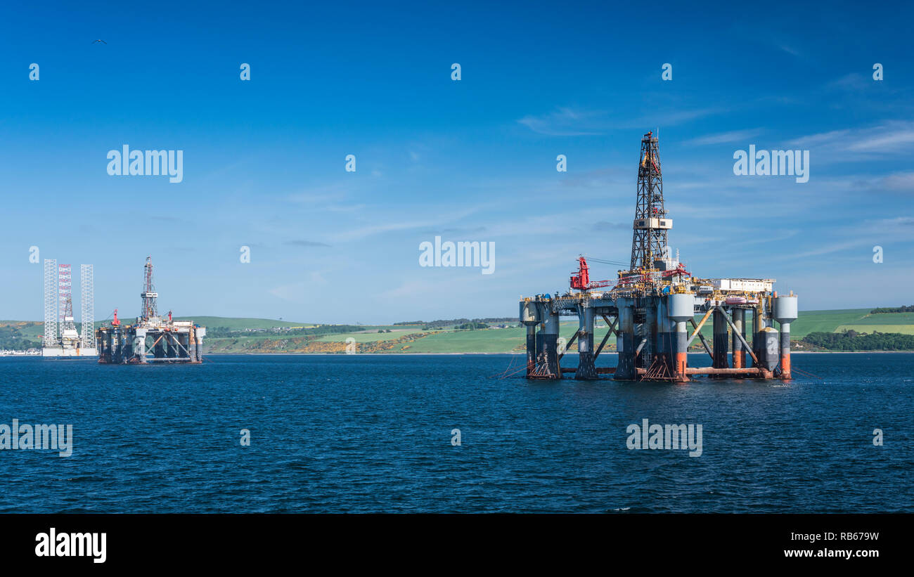 Offshore oil drilling platforms anchored in Cromarty Firth near Invergordon, Scotland, United Kingdom, Europe. Stock Photo