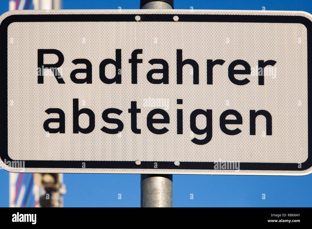 German road sign for cyclists to dismount their bike Stock Photo