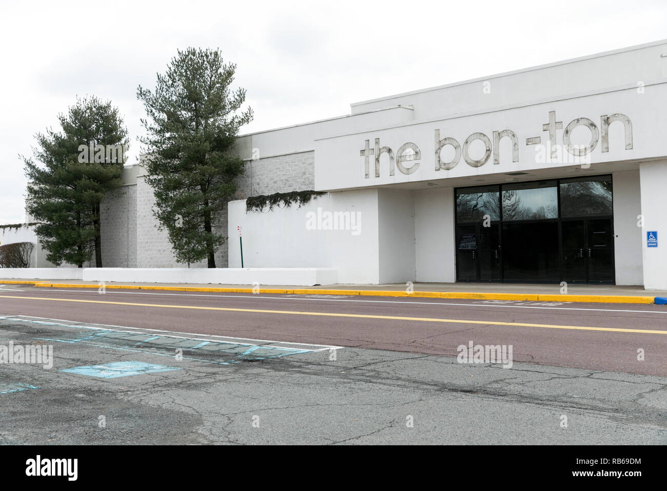 The outline of a logo sign at a closed The BonTon retail store in