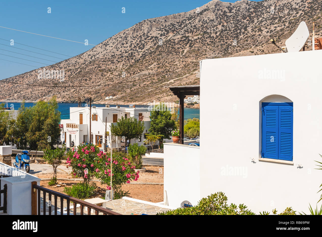 Typical Greek villas in Kamares village with view of sea coast of