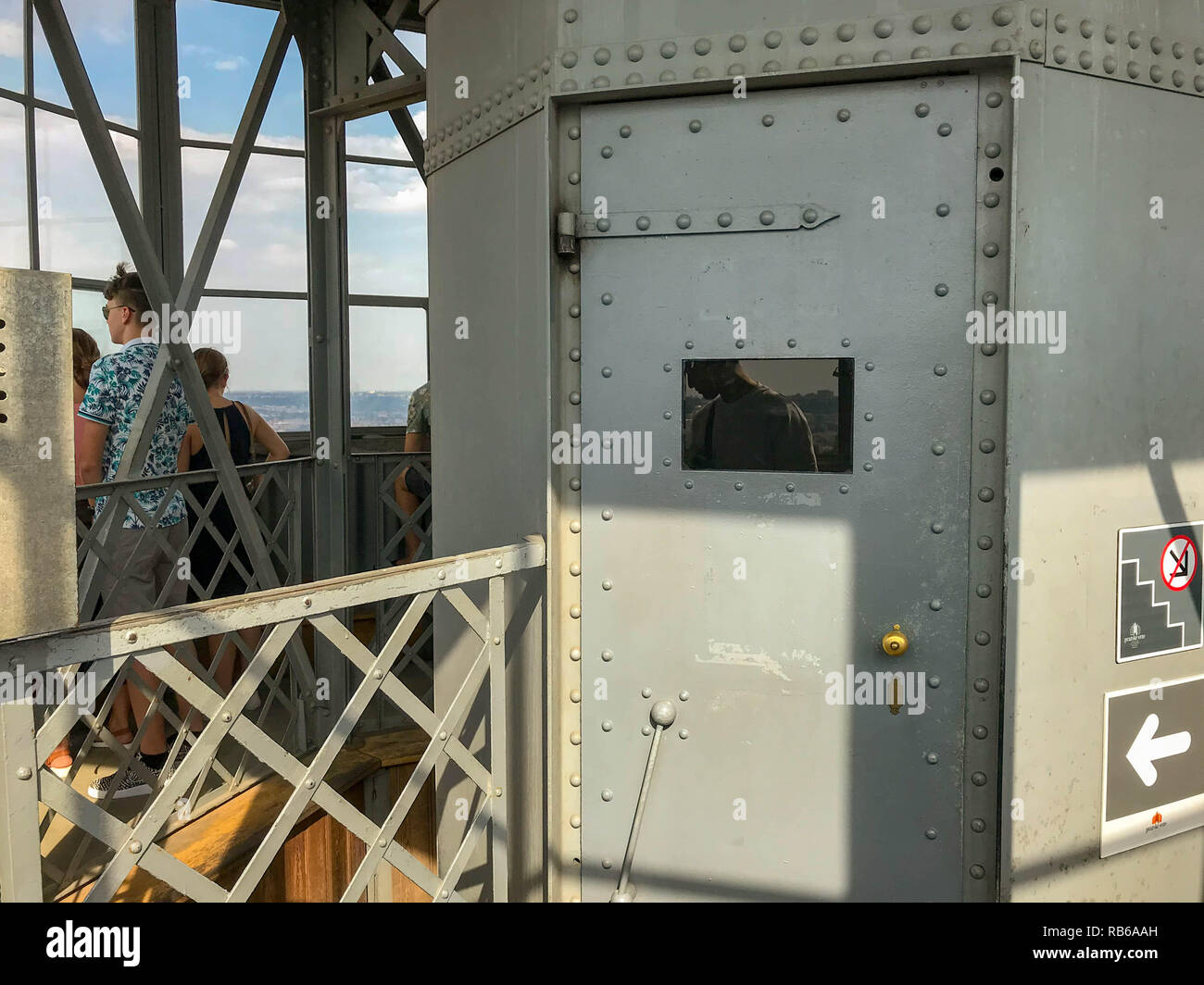 PRAGUE, CZECH REPUBLIC - JULY 2018: The metal plated door of the very small elevator which takes visitors to the top of the Petrin Tower in Prague Stock Photo