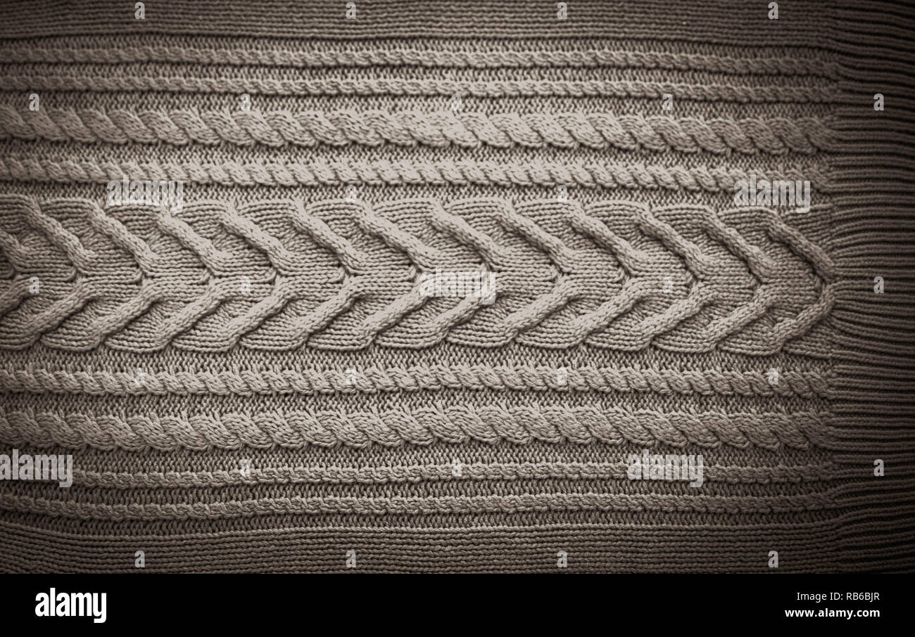 Grey Black Knitted pattern wool sweater texture close up. Handmade grey knitting wool texture background Stock Photo