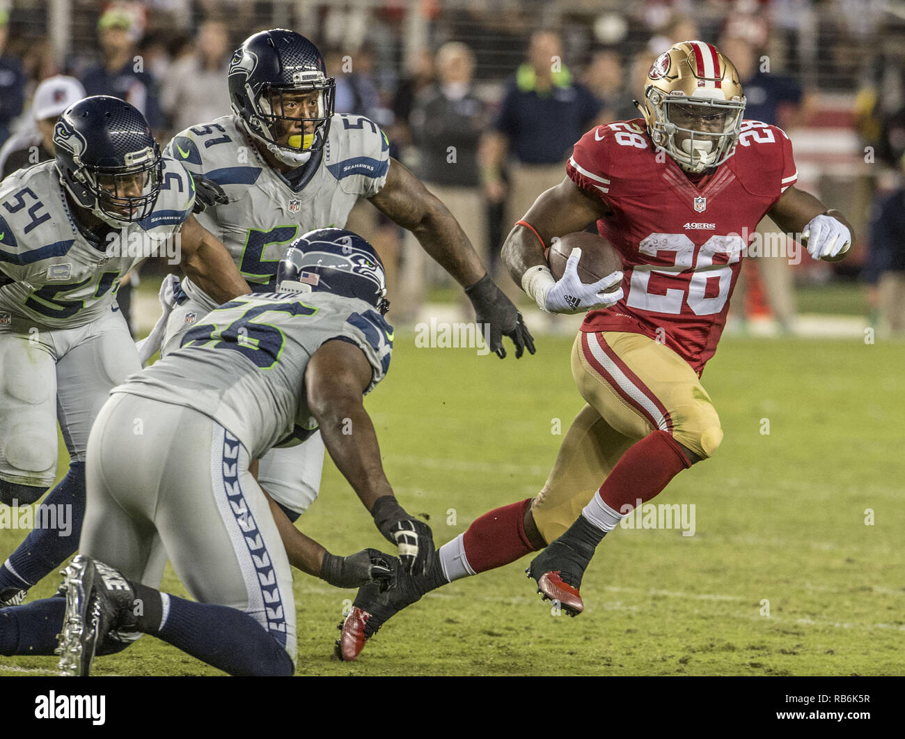 Santa Clara, California, USA. 22nd Oct, 2015. San Francisco 49ers running back Carlos Hyde (28) pulls away from Seattle Seahawks outside linebacker Bruce Irvin (51), middle linebacker Bobby Wagner (54) and defensive end Cliff Avril (56) on Thursday, October 22, 2015, at Levis Stadium in Santa Clara, California. The Seahawks defeated the 49ers 20-3 Credit: Al Golub/ZUMA Wire/Alamy Live News Stock Photo