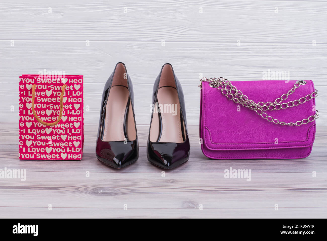 pink heels and clutch bag