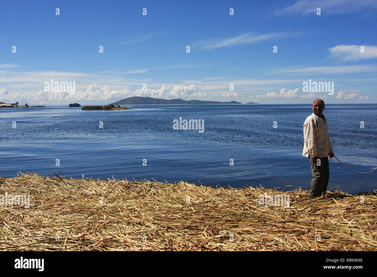 An islander at Uros islands, lake Titicaca, Peru Stock Photo