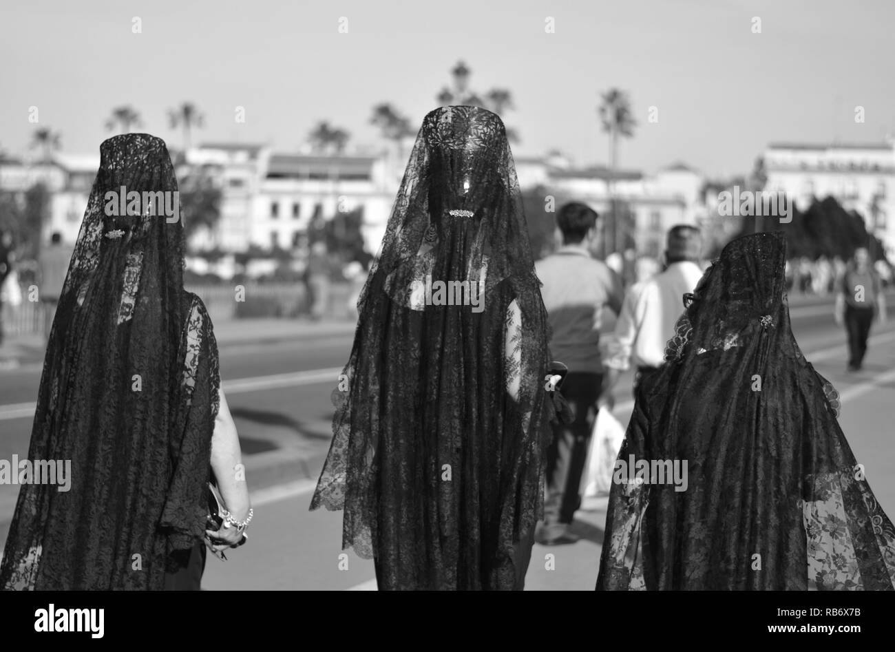 women in a typical and traditional Easter dress, in the streets of Seville,  Spain Stock Photo - Alamy