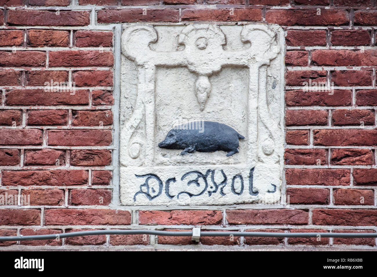 The Netherlands, Amsterdam, gable stone of pork. Stock Photo