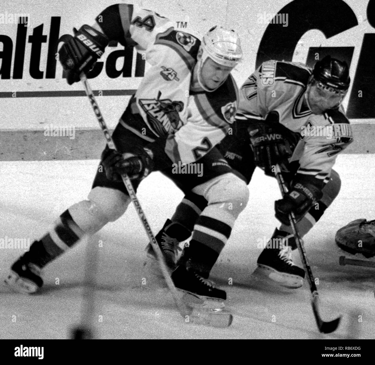 NY Islanders #24 Ken Baumgarter 9left) and Boston Bruins #77 Ray Bourque (right) in action at the Boston Garden in Boston Ma USA photo by bill belknap Stock Photo