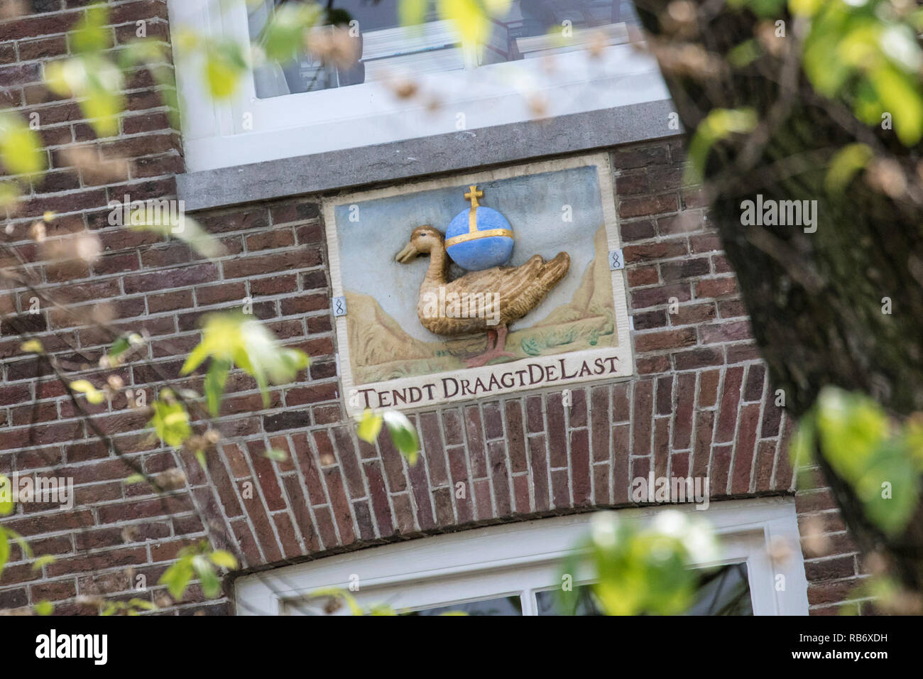 The Netherlands, Amsterdam, Gable stone with duck. Stock Photo