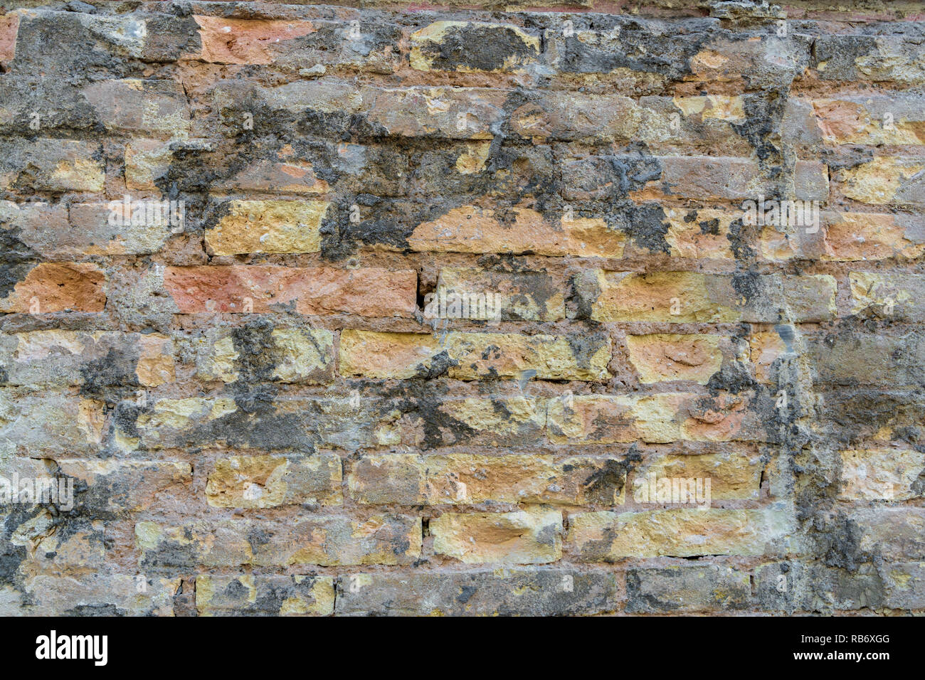 Red Brick  wall. Mediterranean style. Aged wall. Concrete and bricks. Stock Photo