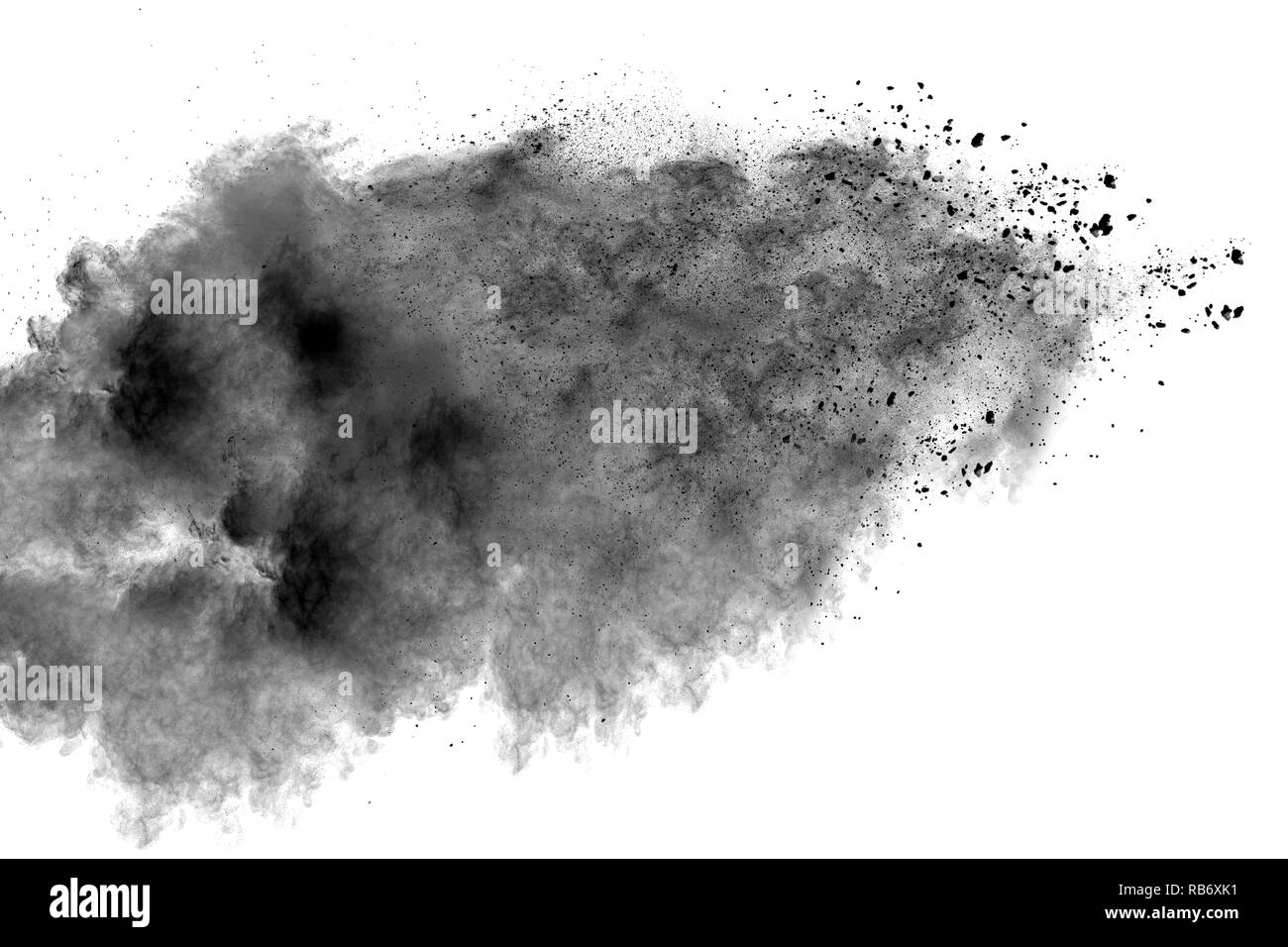 Black powder explosion against white background. Charcoal dust particle