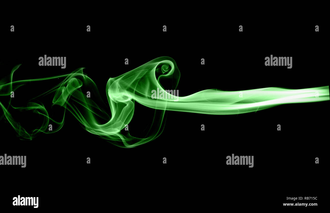 Green smoke on black background Stock Photo - Alamy