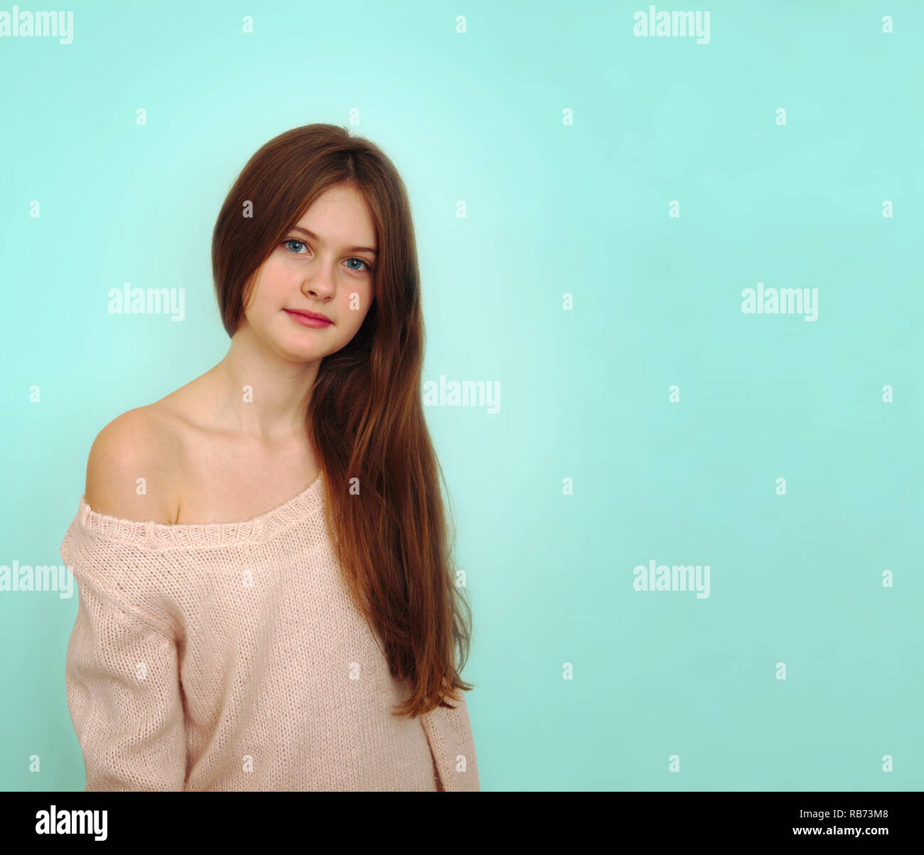 blue eyed brown haired shy girl with flowing hair Stock Photo - Alamy