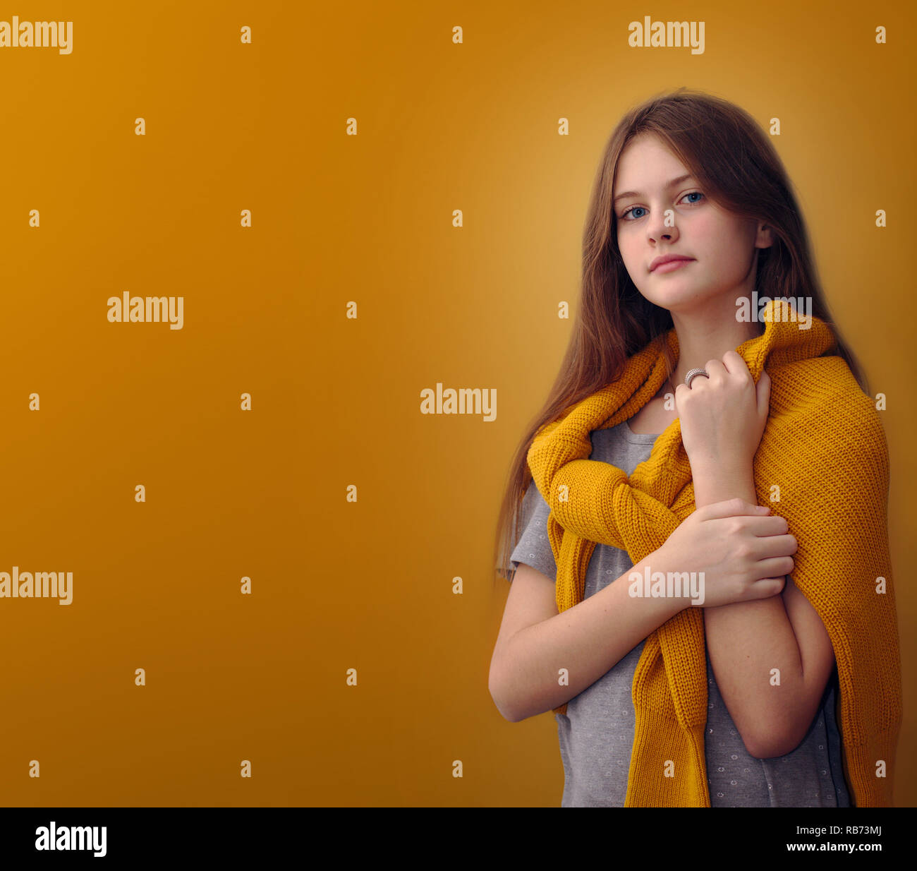 blue eyed brown haired shy girl with flowing hair Stock Photo - Alamy