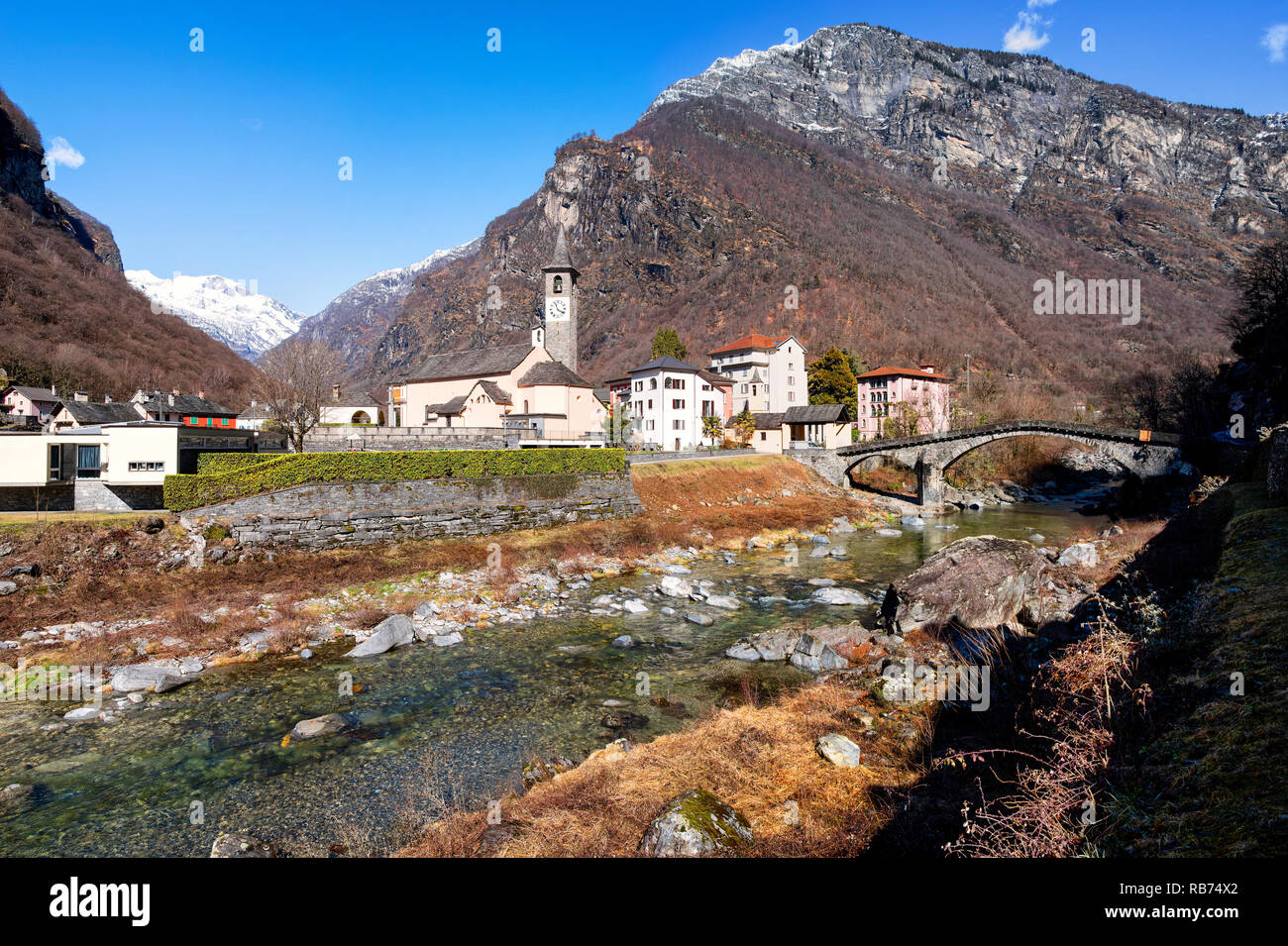 The village of Bignasco on Maggia valley with historic bridge Stock Photo