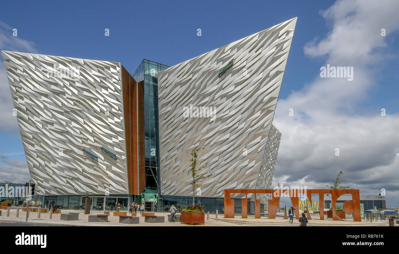 Titanic Building Belfast - panoramic view of the  modern visitor centre in Belfast. People outside Titanic Belfast on a sunny day. Stock Photo