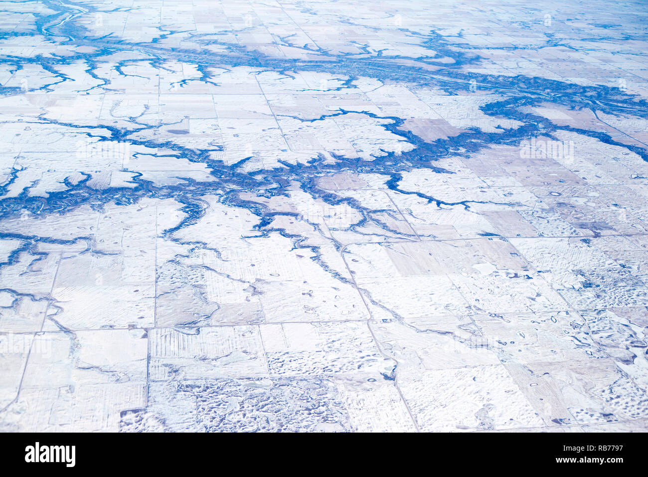 Dendritic river drainage pattern in prairie agricultural landscape, aerial view of the Red Deer River and tributaries near Drumheller, Alberta, Canada Stock Photo