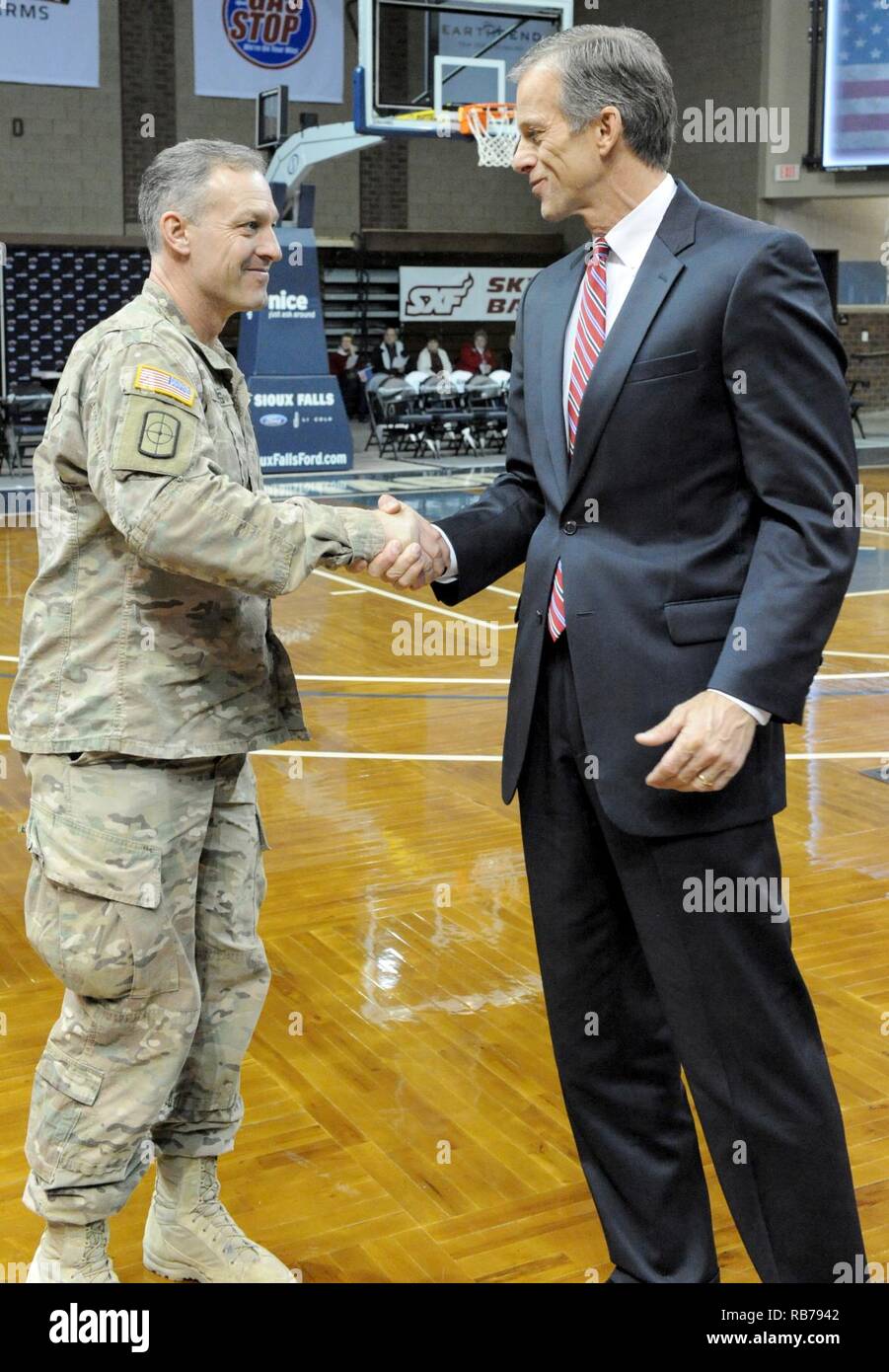 U.S. Senator John Thune welcomes home Maj. James Forbes, 196th Maneuver Enhancement Brigade, South Dakota Army National Guard, during a ceremony at the Sanford Pentagon in Sioux Falls, S.D., Dec. 14, 2016. The Sioux Falls-based unit returned from a 10-month deployment where the Soldiers conducted security and force protection operations at several bases in the country. Stock Photo