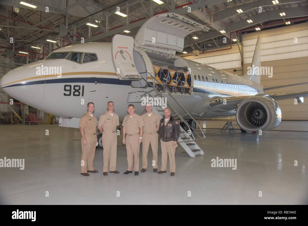 FORT WORTH, Texas (Dec. 1, 2016) Vice Adm. Luke McCollum, chief of Navy Reserve/commander, Navy Reserve Force, poses for a group photo with the Fleet Logistics Support Squadron (VR) 59 chain-of-command in front of a C-40A 'Clipper' at Naval Air Station Fort Worth Joint Reserve Base.  McCollum, formerly deputy commander of the Navy Expeditionary Combat Command, became the 14th chief of Navy Reserve/commander, Navy Reserve Force Sept. 2016. Stock Photo