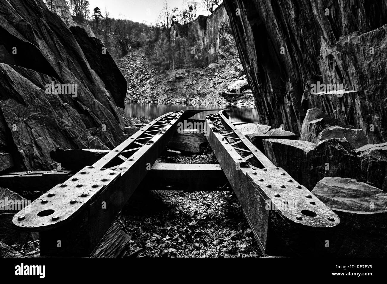 Looking along the rails of a broken crane at Hodge Close Quarry, Lake District Stock Photo