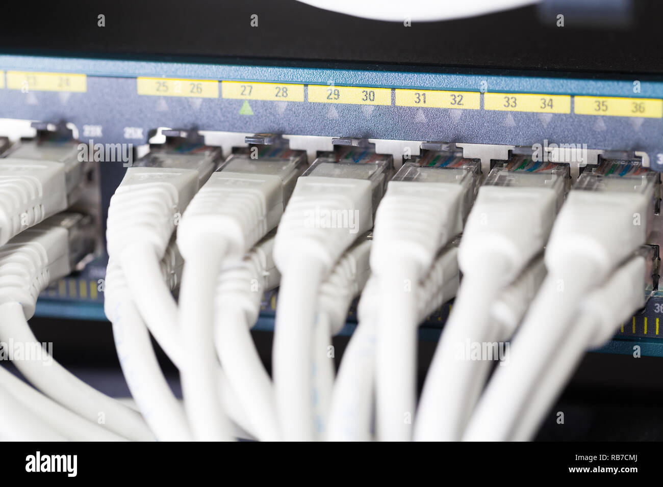Fast Gigabit Ethnernet network switch in datacenter Stock Photo