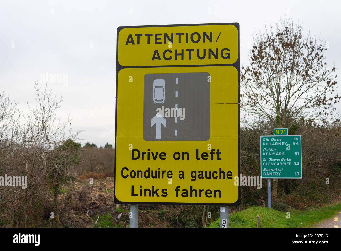 Traffic warning sign to drive on left side of the road. Ireland. Stock Photo