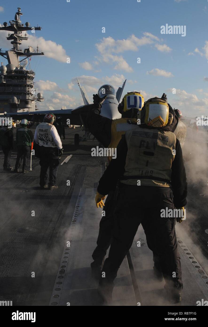 ATLANTIC OCEAN (Dec. 2, 2016) Sailors direct an F/A-18E Super Hornet towards the catapult for take off on the flight deck aboard the aircraft carrier USS George H.W. Bush (CVN 77). GHWB is underway conducting a Composite Training Unit Exercise (COMPTUEX) with the George H.W. Bush Carrier Strike Group in preparation for an upcoming deployment. Stock Photo