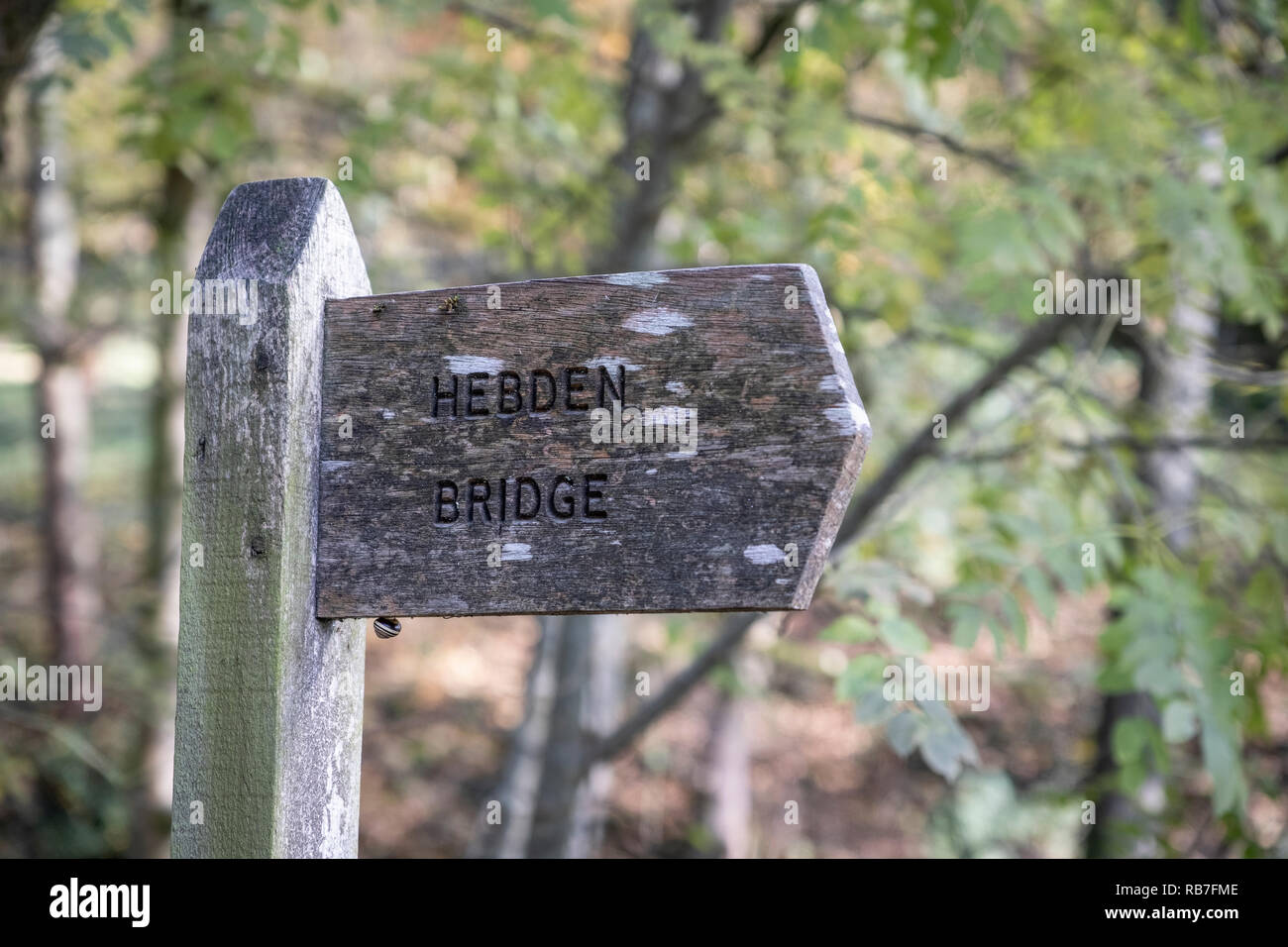 Hebden Bridge wooden signpost Stock Photo - Alamy