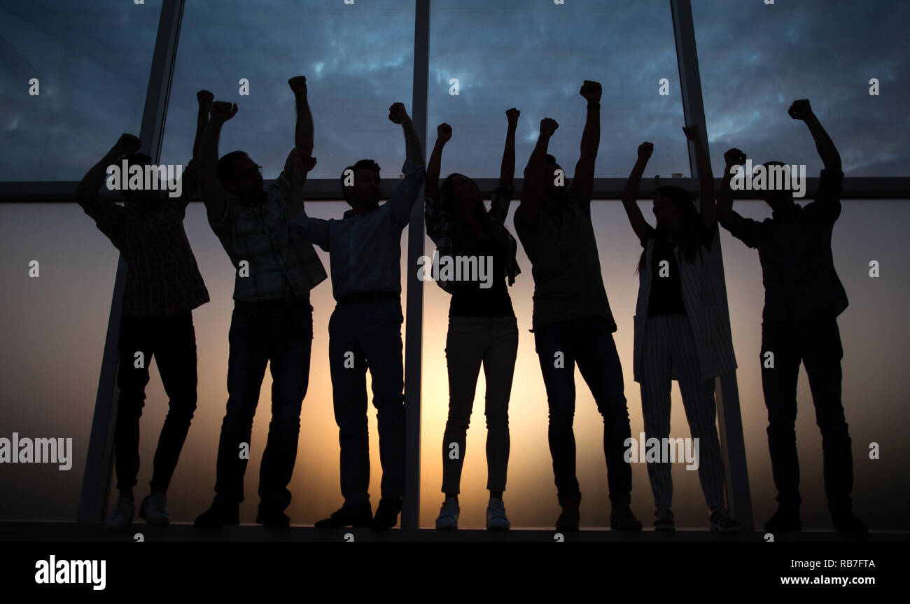 friendly business team standing near the office window Stock Photo - Alamy