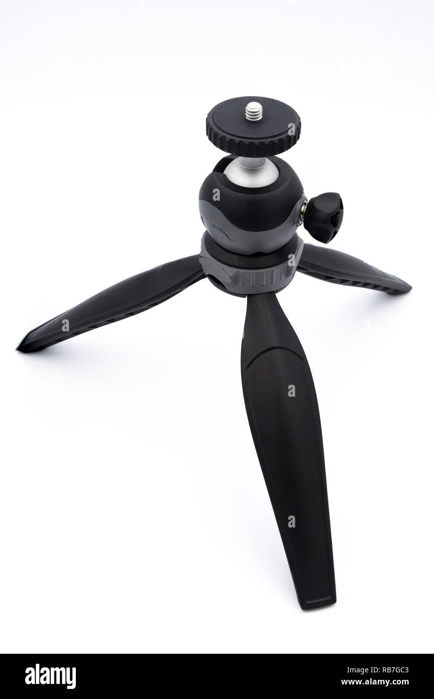 Cut out of a small travel tripod isolated on a white background Stock