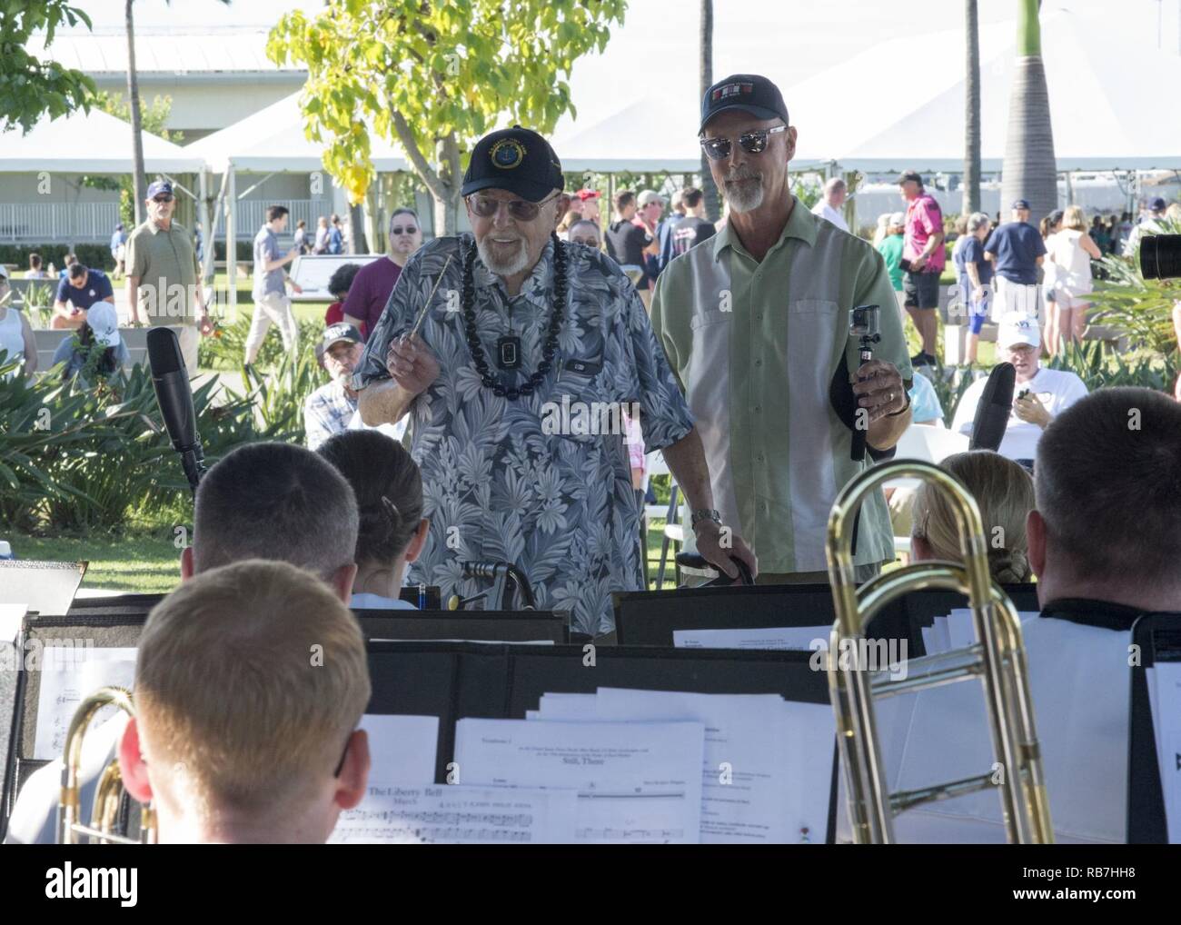 PEARL HARBOR (Dec. 5, 2016) Pearl Harbor survivor and honorary bandmaster Ira John Schab conducts the Pacific Fleet Band during a public performance at the Pearl Harbor Visitor Center. The Pacific Fleet Band made Schab an honorary bandmaster during the concert, one of several performances during the 75th Pearl Harbor Commemoration week. Dec. 7, 2016, marks the 75th anniversary on the attack of Pearl Harbor and Oahu.  As a Pacific nation, the U.S. is committed to continue its responsibility of protecting the Pacific sea-lanes, advancing international ideals and relationships, well as delivering Stock Photo