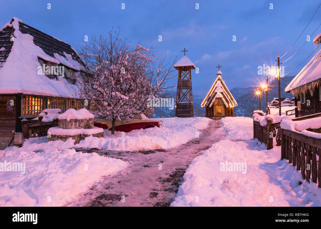 Winter evening view of wooden orthodox church of Saint Sava in Drvengrad ethno village, Serbia. Stock Photo