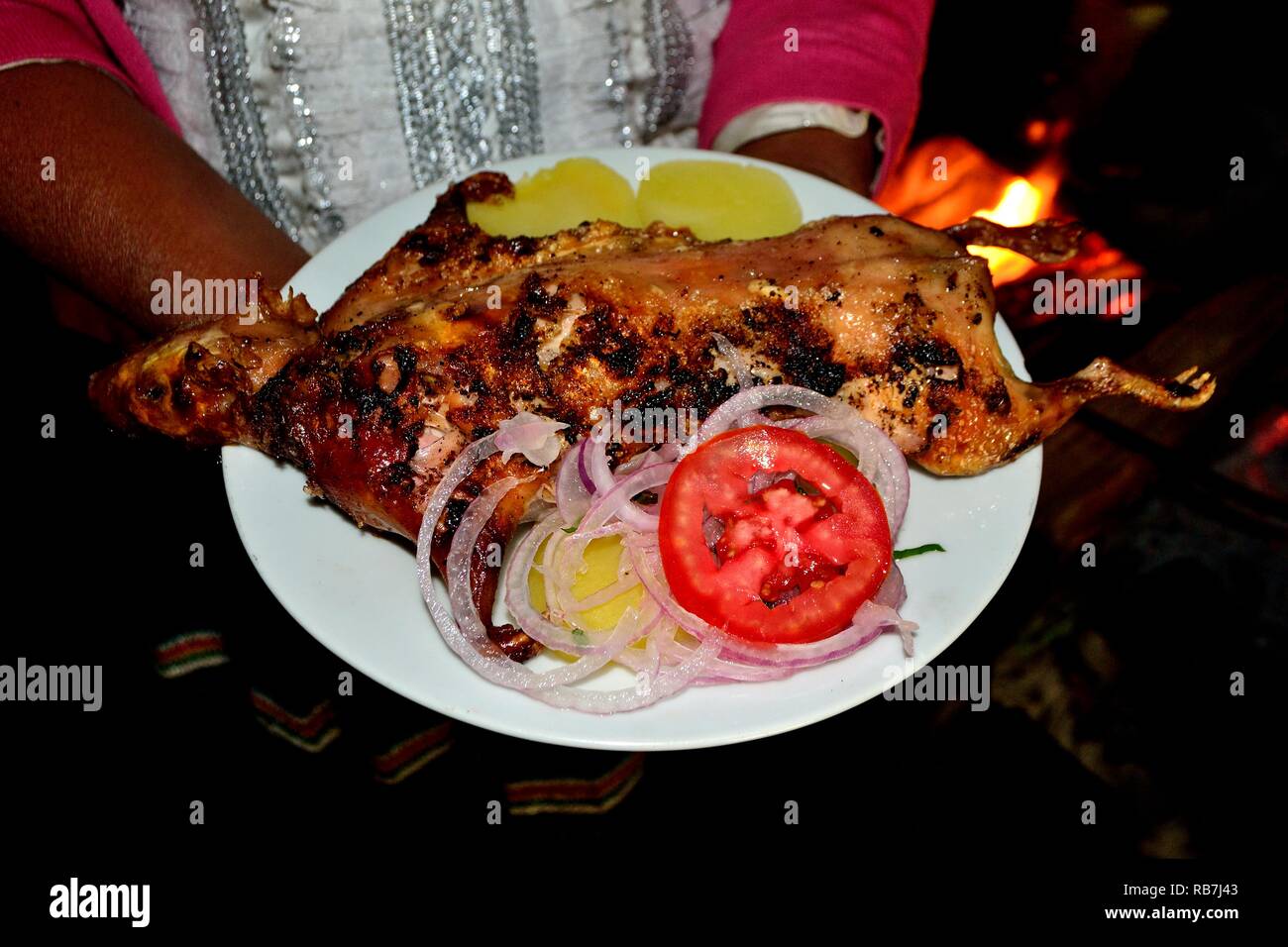 Grilled Cuy - Peasant community restaurant - Llanganuco lagoons  - National park HUASCARAN. Department of Ancash.PERU             Stock Photo